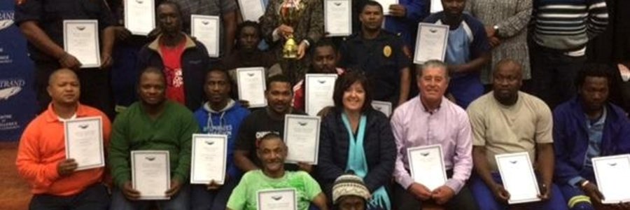 Executive Mayor Botha-Guthrie and Overstrand Municipality participants and volunteers proudly show off the certificates received as well as the trophy awarded to the winning touch rugby team at the Better Together Games